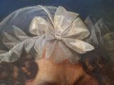 a painting of a woman wearing a veil and a flower in her hair
