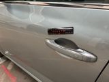 a car door handle with a sticker on it