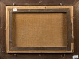an old wooden picture frame with a cork board in the middle
