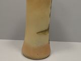 a vase that is sitting on a white table