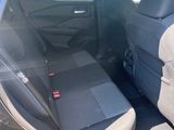 the back seats of a car are empty in the parking lot