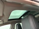 a view of the sunroof from inside of a car