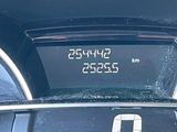 a car dashboard with a digital clock on it