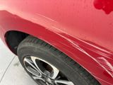 a close up of a red car that has been painted