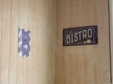 a sign that says bistro on the wall of a room