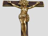 a gold cross with a crucifix on it