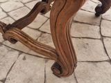 a chair that is sitting on a stone floor
