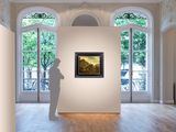a statue in the middle of a room with a painting on the wall