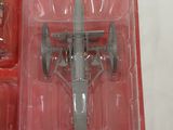 a red box with a toy airplane in it