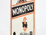a monopoly sign hanging on the wall of a room