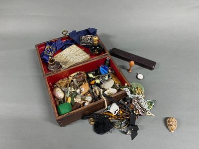 a wooden box filled with assorted items on a table