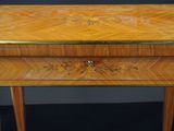 a small wooden table with a drawer on top of it