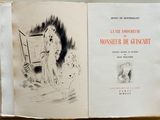 un livre sur lequel figure le dessin d'une femme et d'un chien
