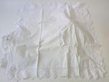 a lot of white napkins sitting on a table