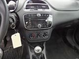 the interior of a car with a steering wheel and dashboard controls