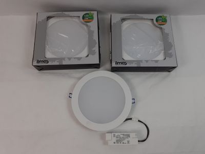 two white led downlights sitting on top of a white table