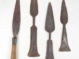 several old tools are displayed on a white surface