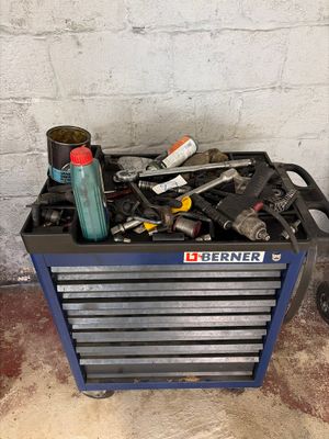 a tool box full of tools on the floor