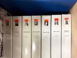 a lot of books that are sitting on a shelf