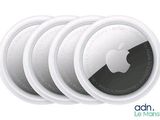 four white round coasters with an apple logo on them
