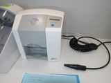 a machine that is sitting on a table with a note in front of it