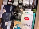 a cardboard box filled with many different types of electronic equipment