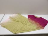 a white table with a pink and yellow shirt on it