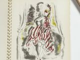 a drawing of a woman in a red dress on a notebook