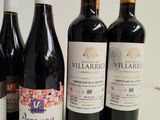 several bottles of wine are lined up on a table