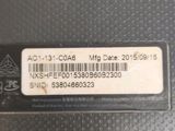 a close up of a label on the back of a laptop computer