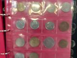a picture of a pink binder with coins in it