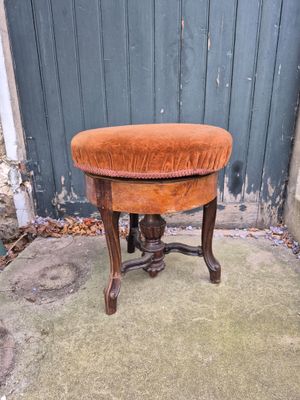 a small stool that is sitting on a cement floor