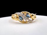 une image représentant une bague en or sertie de diamants bleus et blancs