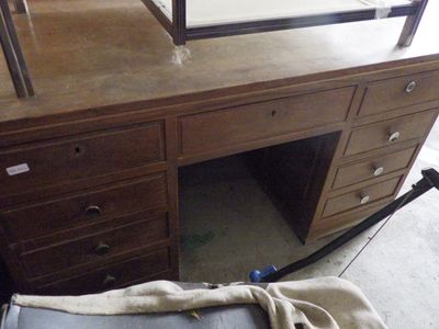 a suitcase sitting on the floor next to a desk