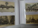 a person holding a book open to show pictures of a city