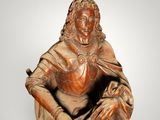 statue of a woman sitting on a chair with a dog