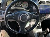 dashboard view of a car with a steering wheel and dashboard controls