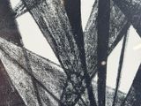 a black and white photo of a wind wheel