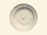 a white plate with a brown design on it