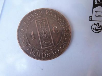 a coin that is sitting on top of a piece of paper