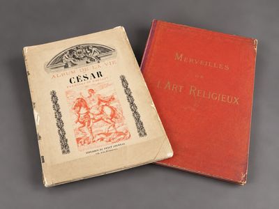two books are sitting side by side on a table