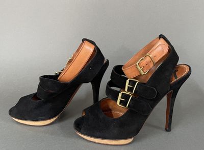 black sued high heel shoes with gold buckles on the toes