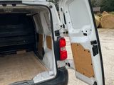 a white van with its door open on the side of the road