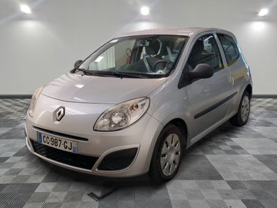 a picture of a small silver car parked in a garage