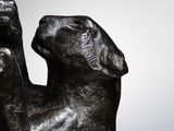 a statue of a cat that is sitting on a table