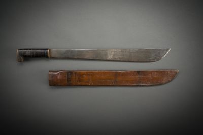 two knives that are sitting next to each other on a table