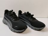 the puma sneakers are black and grey on a white background