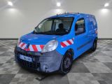 a blue van with red and white stripes parked in a room