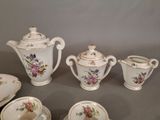 five pieces of porcelain tea and coffee set on a table