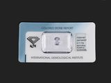 an image of a piece of diamond sitting on top of a card